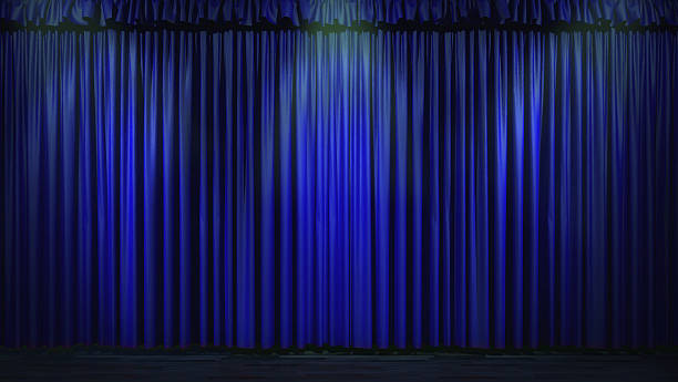 istock 3d blue curtain lit by spot lights 470429754