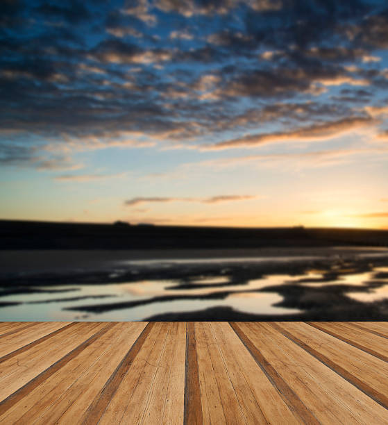 istock Vibrant sunrise landscape reflected in low tide water on beach 470432636