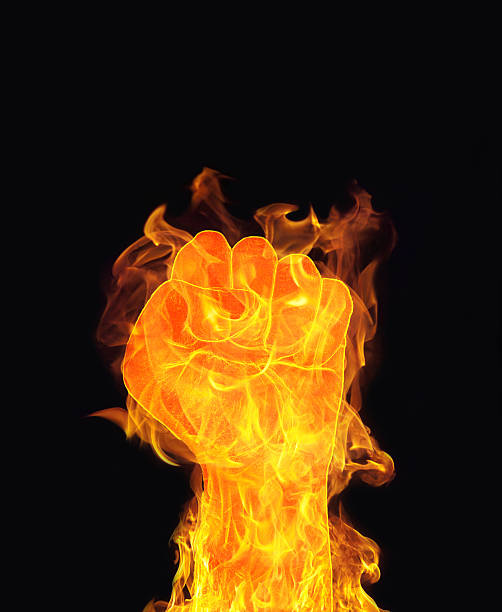 istock inferno Fire fist on black background 470432853