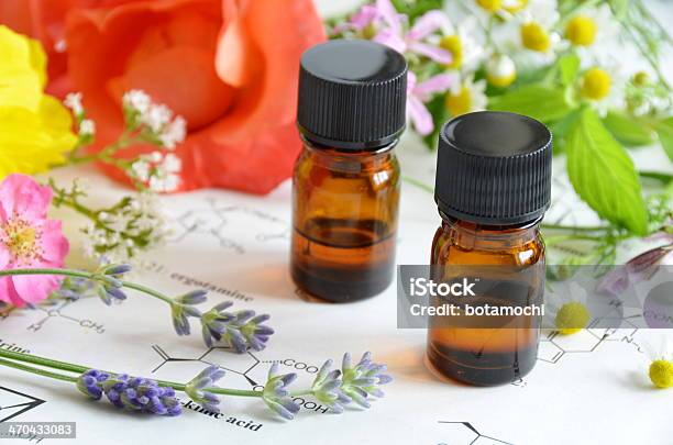Essential Oils With Herbal Flowers Stock Photo - Download Image Now - Alternative Therapy, Aromatherapy, Aromatherapy Oil