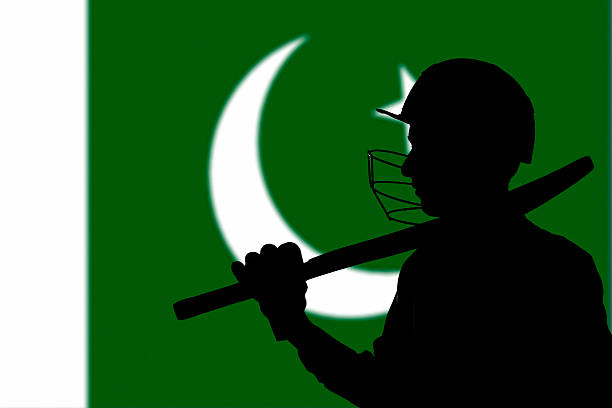 istock Cricketer silhouette on Pakistan blurred flag background 470433172