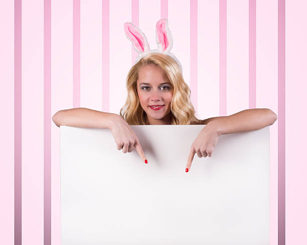 Bunny girl with blank banner stock photo