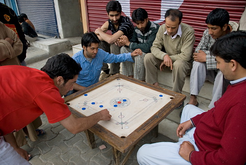 Srinagar, India - May 6th, 2009: Unidentified Kashmiri men play traditional board game \
