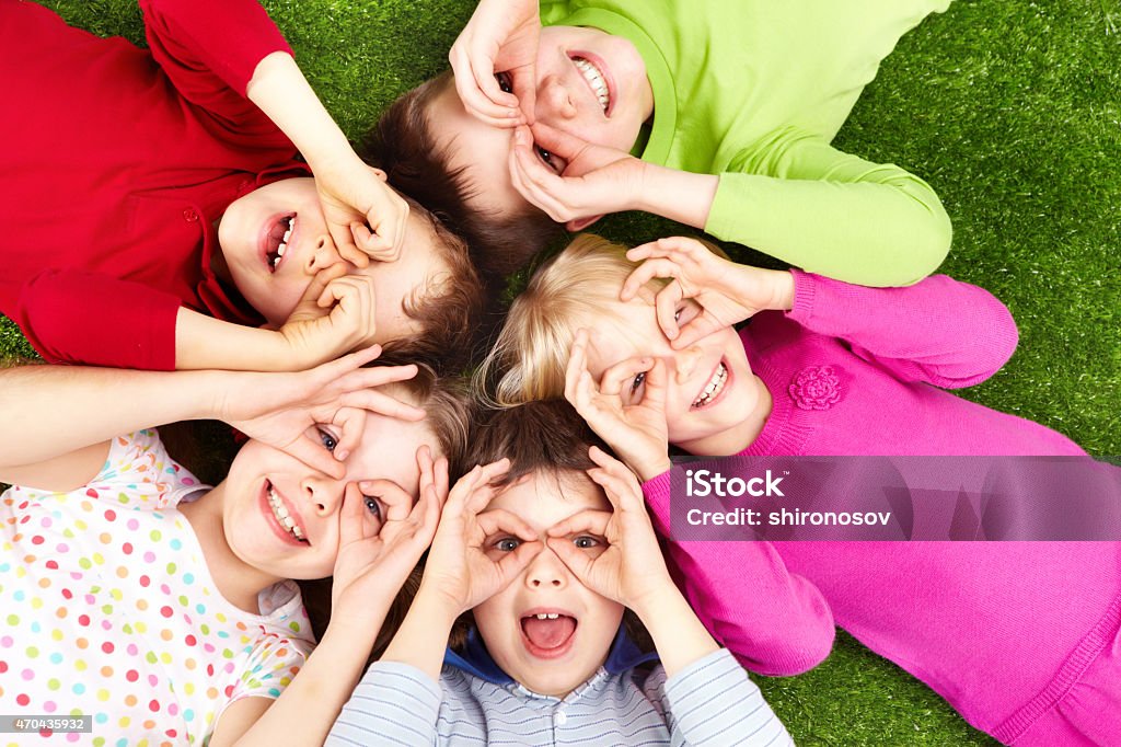 Funny kids Image of funny kids playing on the grass 2015 Stock Photo
