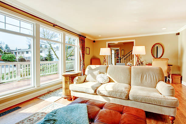 istock Floor-to-ceiling windows living room with a rustic beige couch 470438167