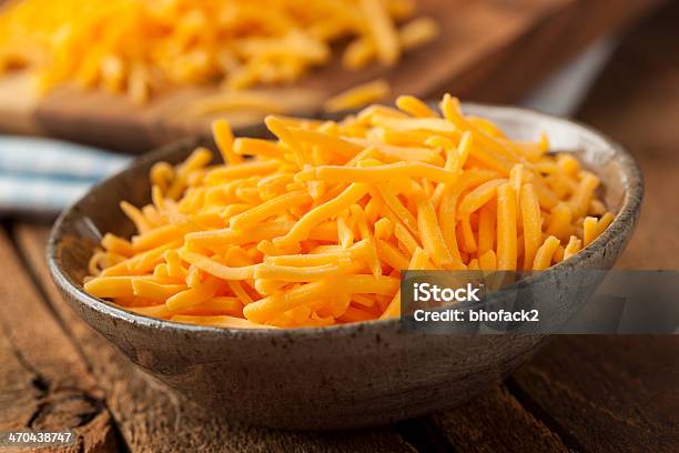 Organic Shredded Sharp Cheddar Cheese Stock Photo - Download Image Now - Block Shape, Cheddar Cheese, Cheese