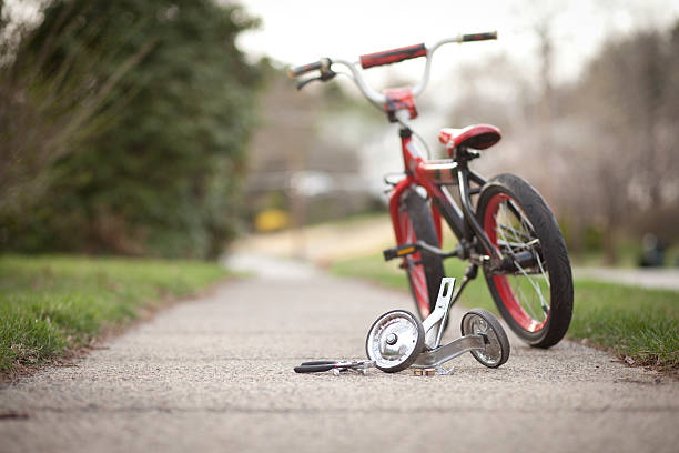 Training wheels taken off child bicycle stock photo