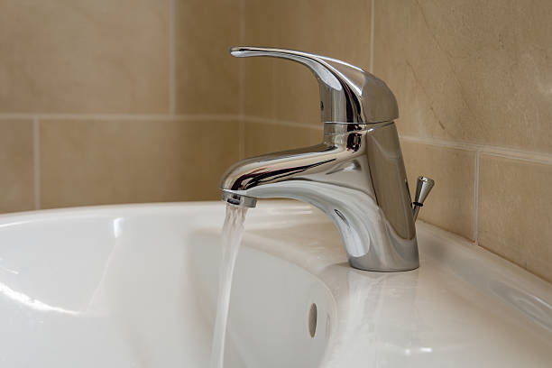 Single lever monobloc chrome mixer tap on bathroom sink