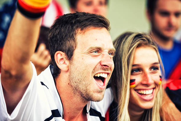 Sports fans cheering a game