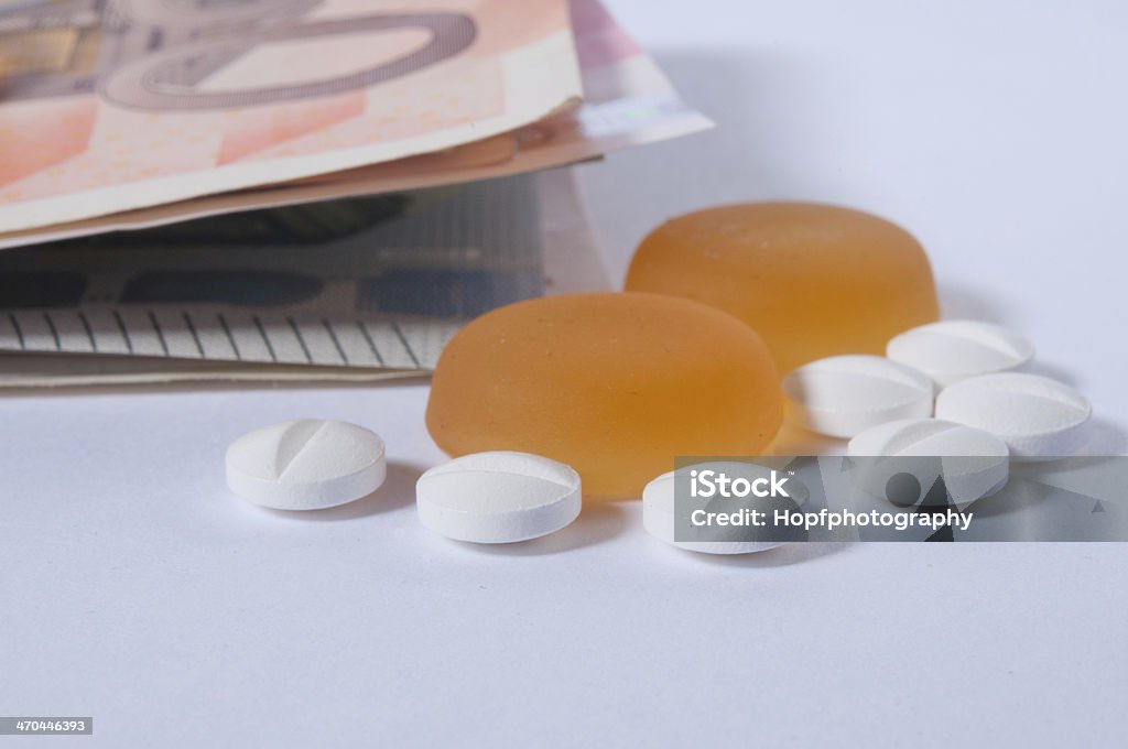 Tablets and money Paper money and tablets at white Euro Symbol Stock Photo