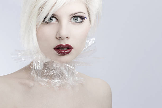 istock Young futuristic woman model in plastic 470446745