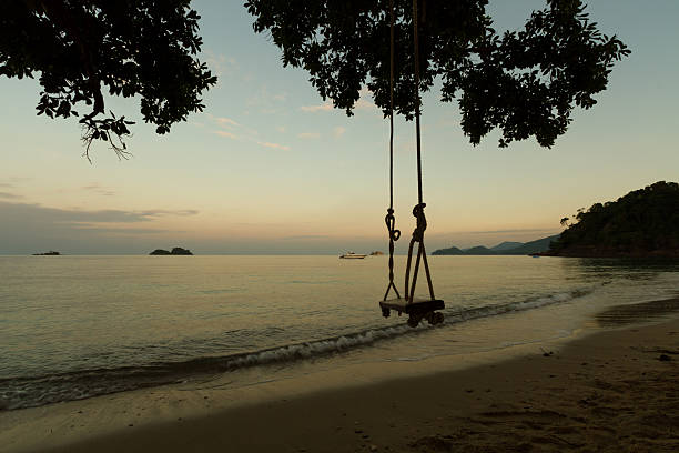 istock Swing on the beach at the morning 470450956