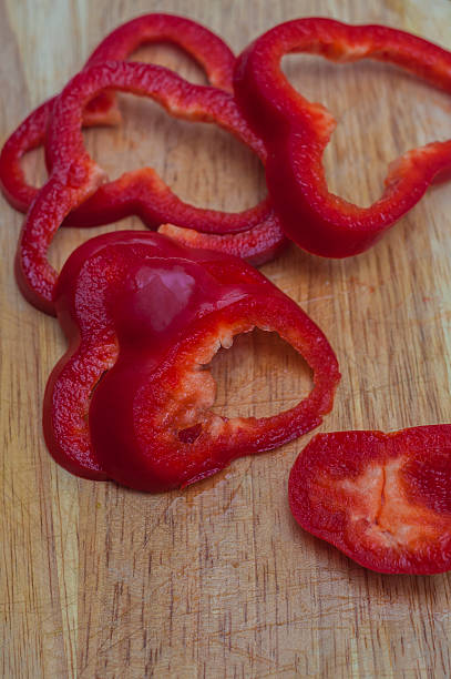 istock Sliced red pepper on a wooden table 470451412