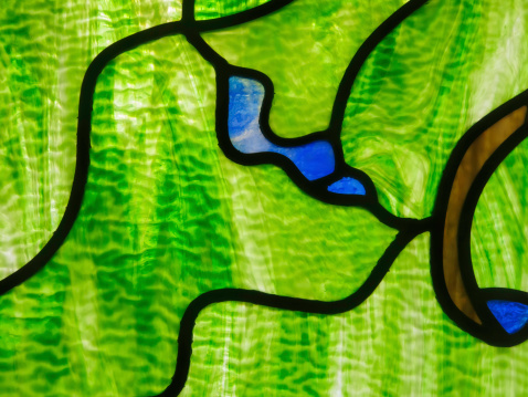 Abstract macro of stained glass window in a children's center of a hospital complex