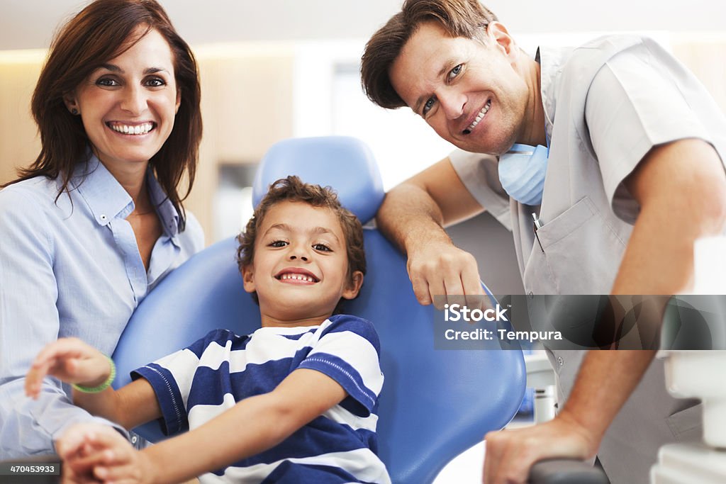 Motehr and son at the dentist office. At the dentist office, medical. More files of this series and model on port.  Dentist Stock Photo