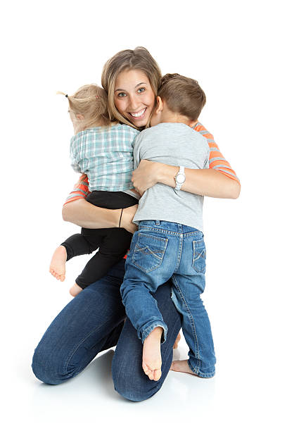 istock Happy Mother Hugging Children 470454671