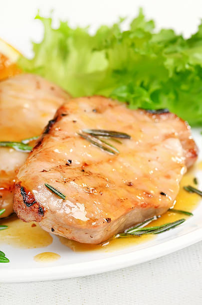 istock Grilled pork cutlet with orange sauce 470454786