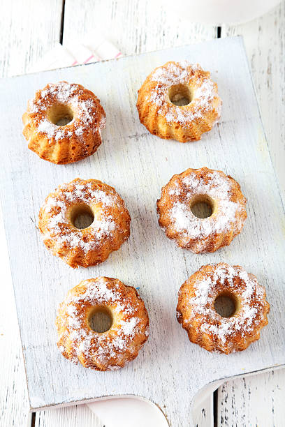 istock Bundt cakes on cutting board on white wooden background 470454868