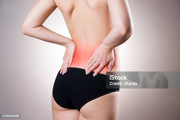 Pain In Lower Back Of Women Stock Photo - Download Image Now - Lower Back, Pain, Women