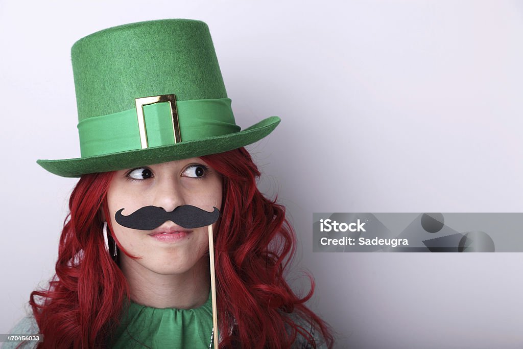 Miss Leprechaun Teenage girl with Leprechaun's hat and fake moustache Adult Stock Photo