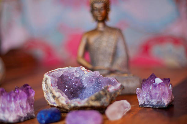 Crystals and Buddha Various crystals in the foreground and Buddha statue in the back crystal altar stock pictures, royalty-free photos & images