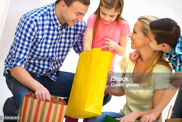 Family In Shopping Together Stock Photo - Download Image Now - 30-39 Years, Adult, Blue