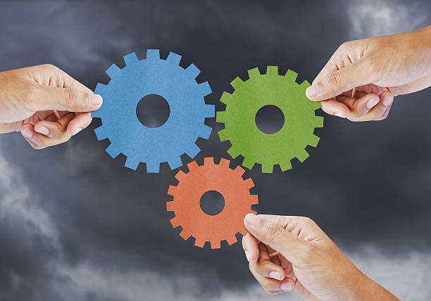 istock Hand show gear to teamwork as concept 470457389