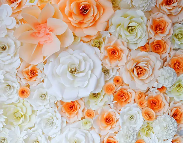 Background of paper-folding flower in orange and white color