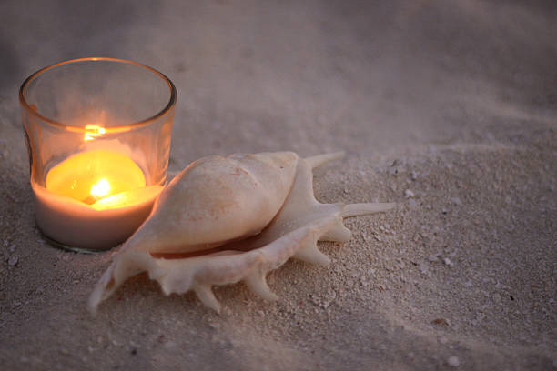 istock Romantic Candle on the Beach with Sea Shell 470463236
