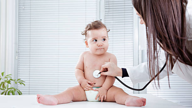 istock Pediatrician doing checkup on baby 470467127