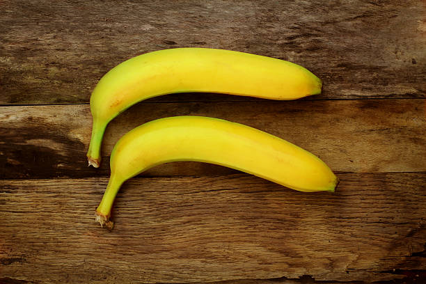 istock Bananas on wood background 470468457