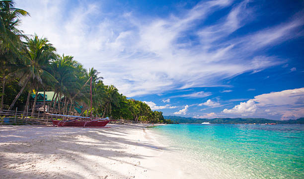 istock Tropical beach with white sand and a small boat 470470213