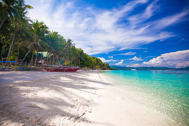istock Tropical beach with white sand and a small boat 470470229