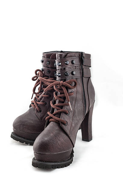 istock lady leather boot bown with shoelace on white background 470470772