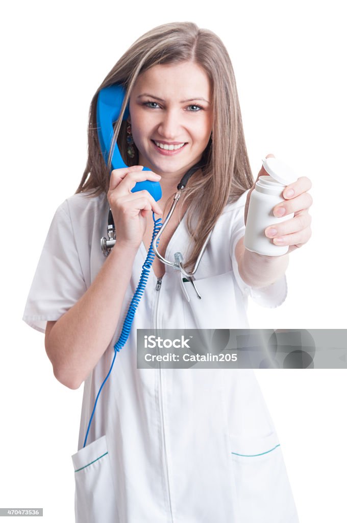 Contact hospital or clinic for refill of pills Contact hospital or clinic for refill of pills concept with female doctor holding a white recipient 2015 Stock Photo