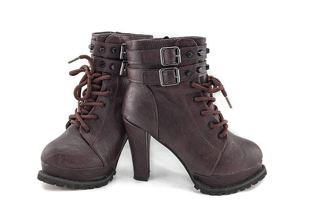 istock lady leather boot bown with shoelace on white background 470474142