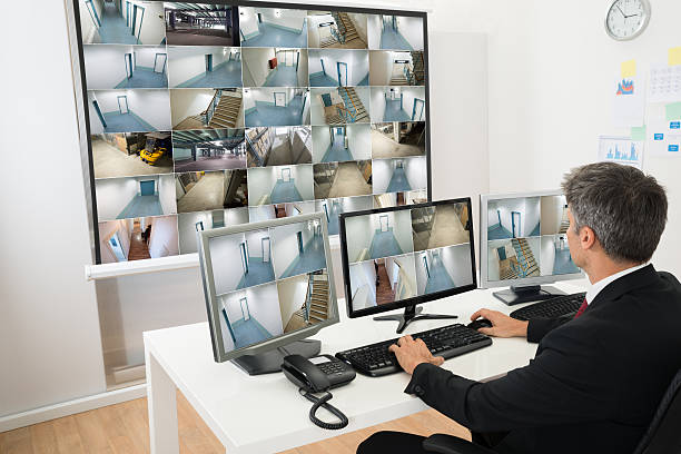istock Man In Control Room Looking At Cctv Footage 470474160