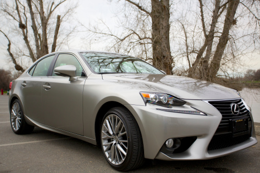 Sacramento, California, USA, - February 15, 2014: The Lexus IS250 introduces a new body style in 2014. Pictured here in Atomic Silver parked along the Sacramento River.