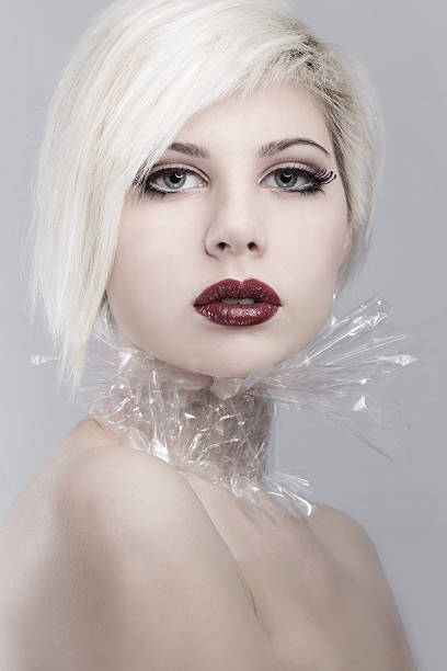 istock Blonde young woman model in plastic 470477767