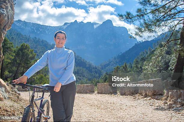 Woman Biking Stock Photo - Download Image Now - 2015, Activity, Adult