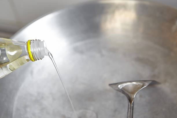 istock Pouring cooking oil 470487894