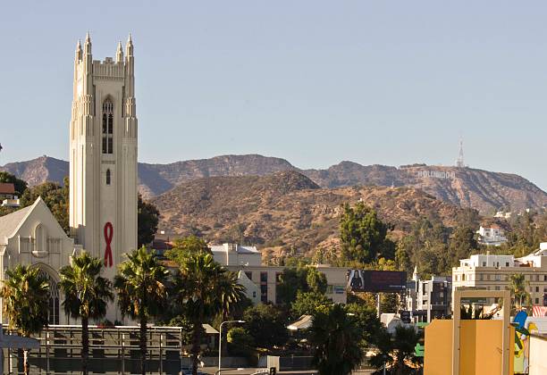 Los Angeles, Usa - August 17, 2013: The Hollywood Sign from the distance, icon located in Los Angeles, California. It is situated on Mount Lee. View from the distance with the church in the foreground.