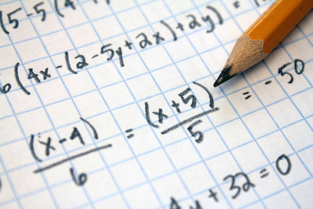 math problems math problems on graph paper with pencil mathematical symbol stock pictures, royalty-free photos & images