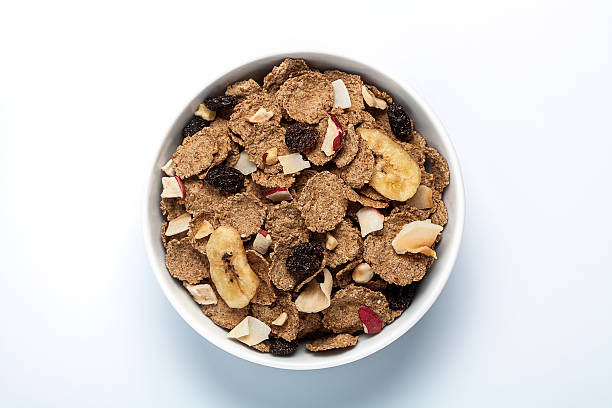 cereal breakfast in a bowl top view of fruit and fibre cereal in a bowl bran flakes stock pictures, royalty-free photos & images