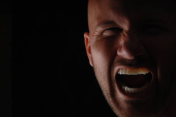 istock Close Up of Man Growling 470503540