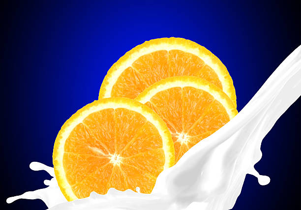 Splashing milk with orange