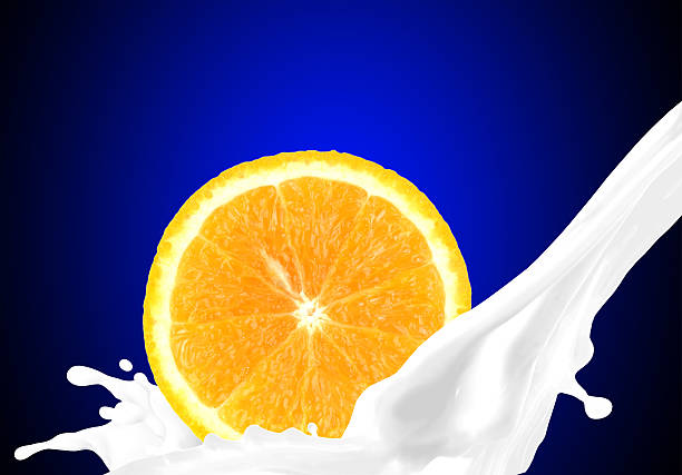 Splashing milk with orange