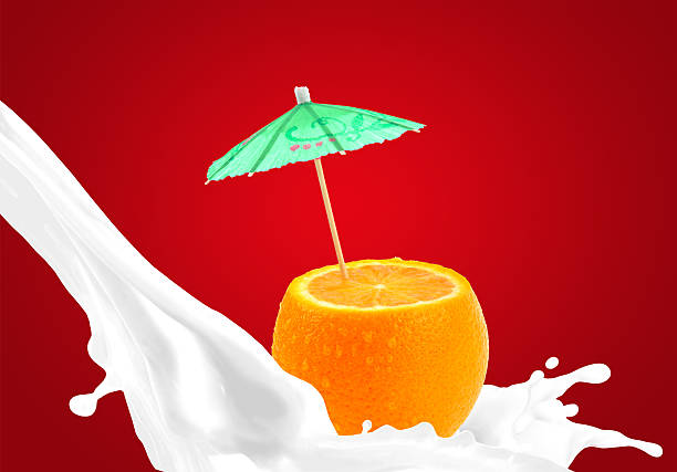 Splashing milk with orange