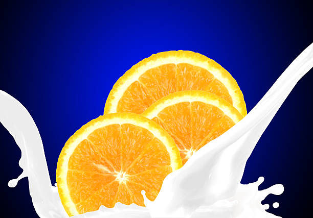 Splashing milk with orange