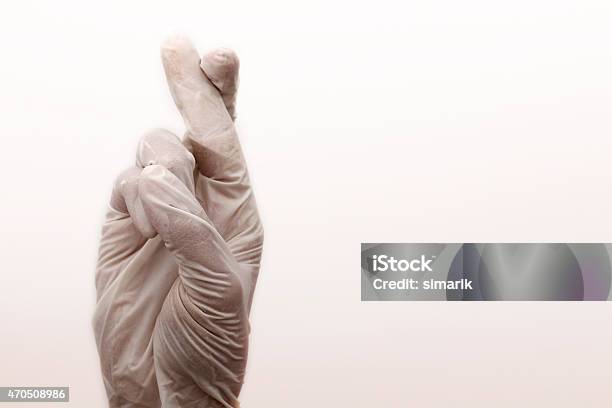 Medical Gloves Wishing Luck Stock Photo - Download Image Now - 2015, Backgrounds, Body Care